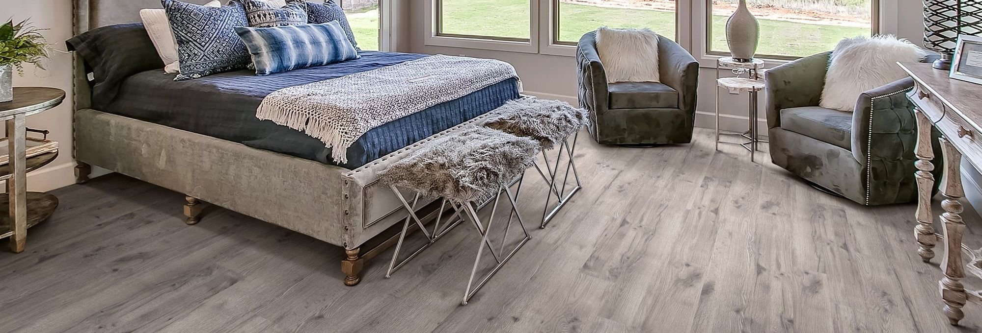 Bedroom with wood-look laminate flooring from Korfhage Floor Covering in the Louisville, KY area